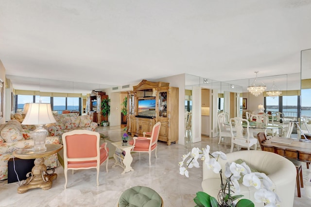 living room with a chandelier and plenty of natural light