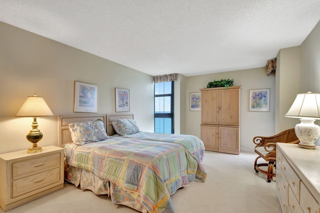 tiled bedroom with a textured ceiling