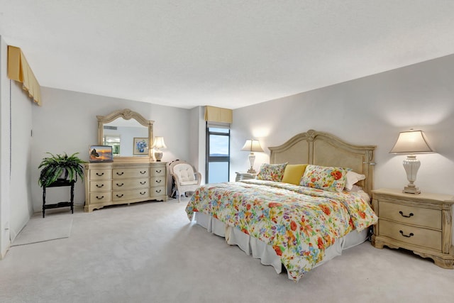 bedroom featuring light colored carpet