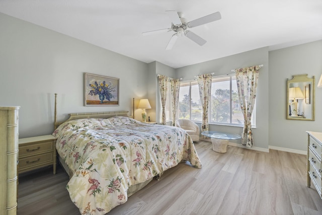 bedroom with ceiling fan and light hardwood / wood-style floors