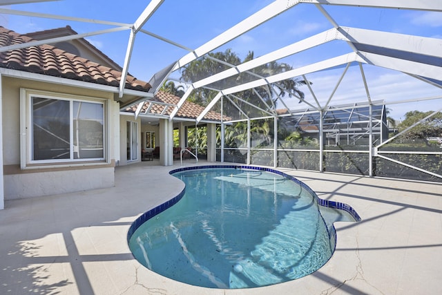 view of pool featuring a lanai and a patio