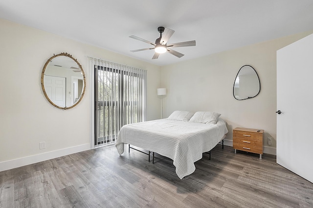 bedroom with hardwood / wood-style floors and ceiling fan