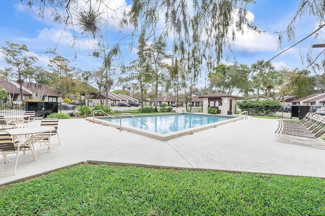 view of swimming pool with a patio