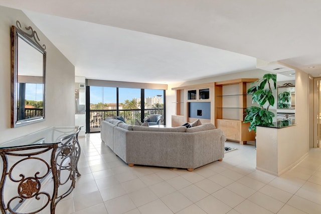 living room with light tile patterned floors and a healthy amount of sunlight