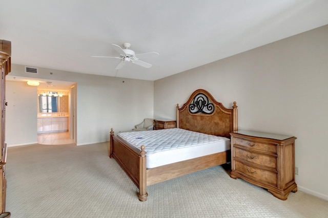 carpeted bedroom with ceiling fan and connected bathroom