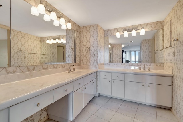 bathroom featuring tile patterned flooring and vanity