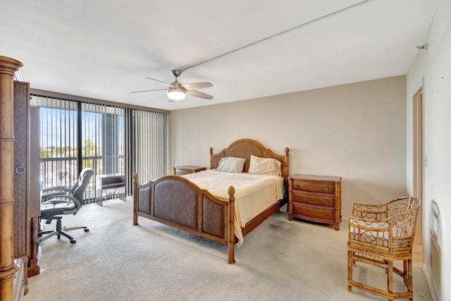 carpeted bedroom with ceiling fan and floor to ceiling windows