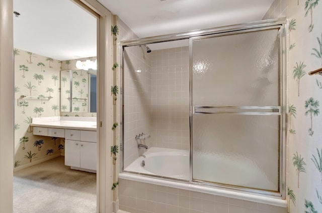 bathroom with enclosed tub / shower combo and vanity