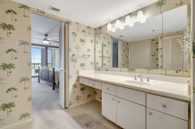 bathroom with ceiling fan and vanity