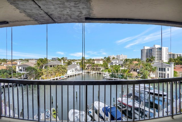 balcony featuring a water view