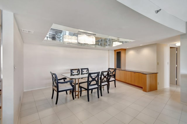 dining space with light tile patterned floors