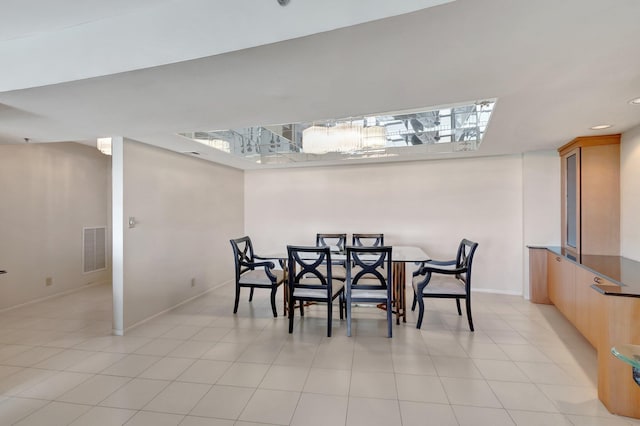 dining space with light tile patterned flooring