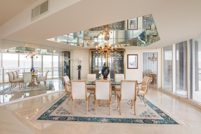 tiled dining area featuring a chandelier and plenty of natural light