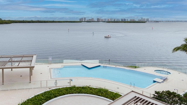 view of pool with a water view