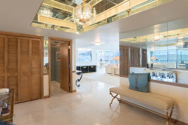 interior space featuring a towering ceiling and tile patterned floors