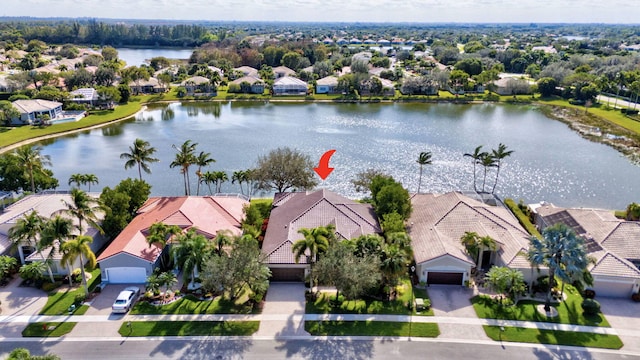 birds eye view of property with a residential view and a water view