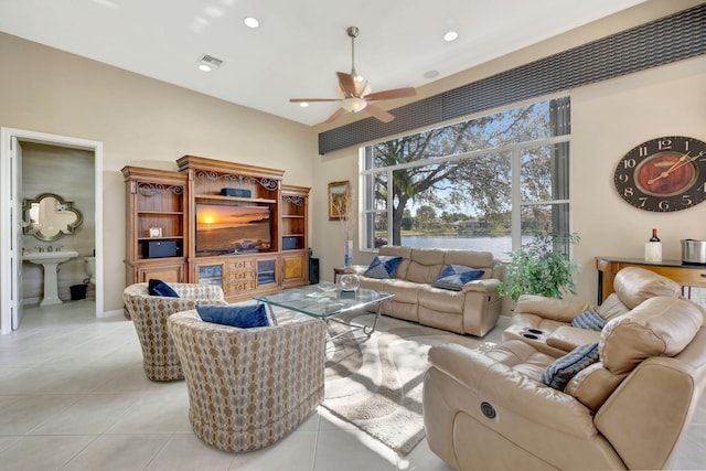 tiled living room with sink and ceiling fan