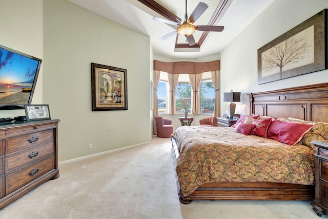 bedroom with a ceiling fan, light colored carpet, and baseboards