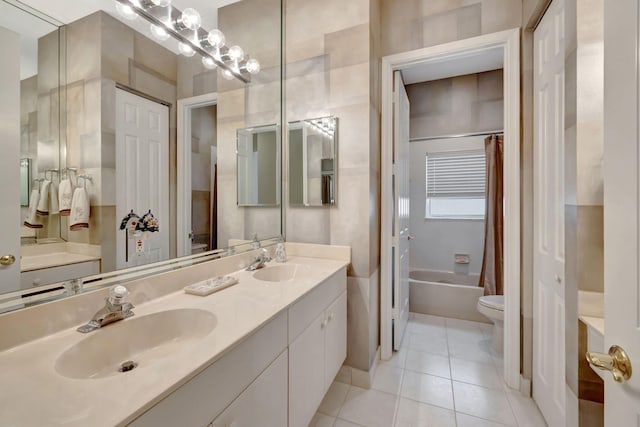 full bathroom featuring tile patterned flooring, vanity, shower / bath combo, and toilet