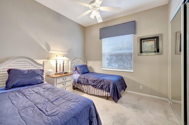 view of patio featuring a water view and ceiling fan