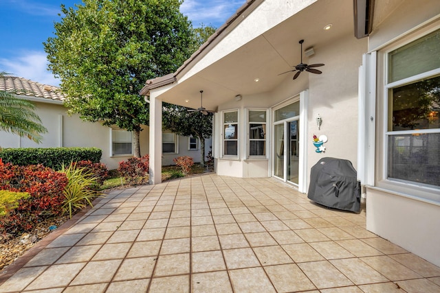 view of patio / terrace featuring a grill and ceiling fan