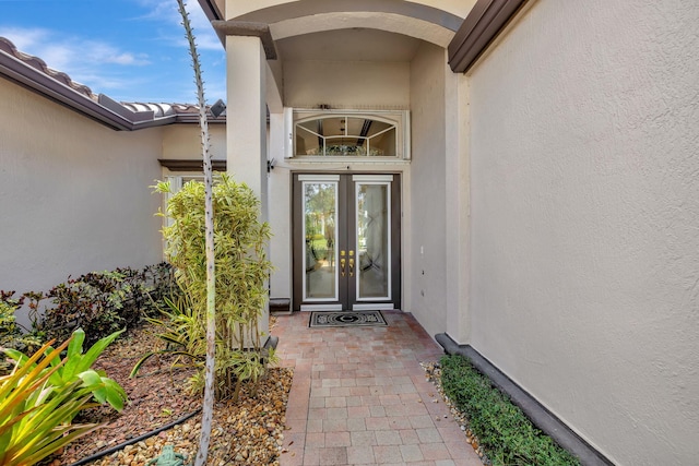 doorway to property with stucco siding