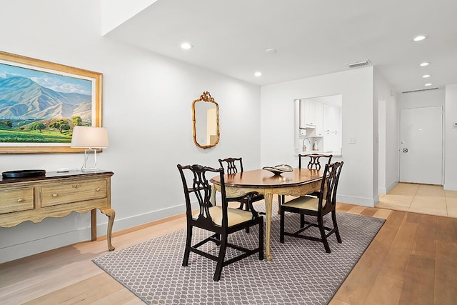 dining area with light wood-type flooring