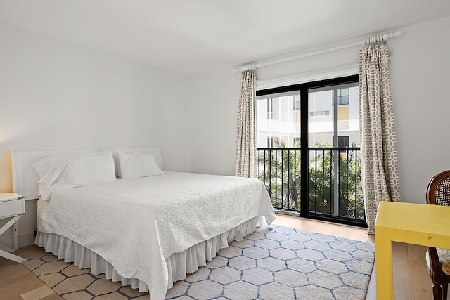 bedroom featuring light wood-type flooring and multiple windows