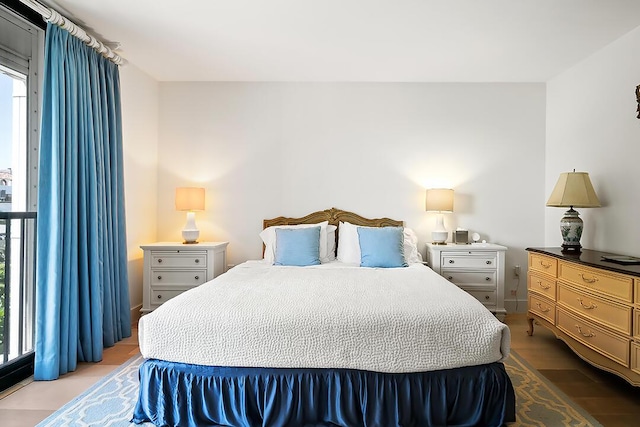 bedroom with hardwood / wood-style floors