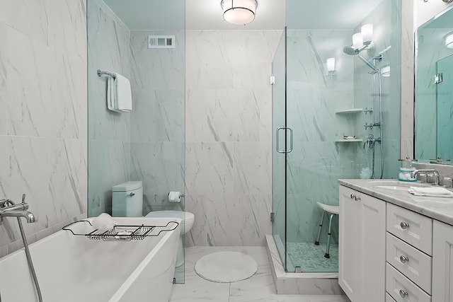 bathroom with vanity, separate shower and tub, and tile walls