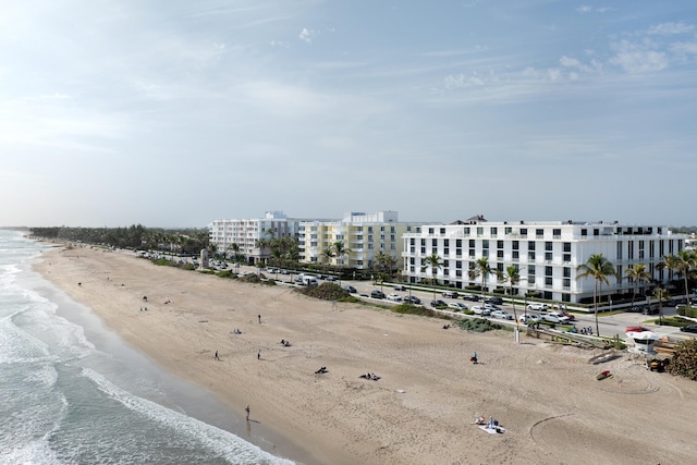 aerial view featuring a view of the beach and a water view