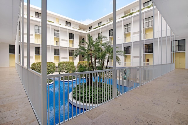 view of swimming pool with a water view