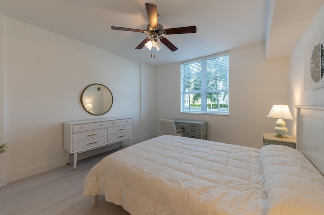 bedroom with ceiling fan and light hardwood / wood-style floors