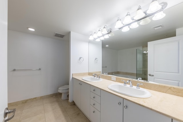 full bathroom featuring toilet, shower with separate bathtub, vanity, and tile patterned floors