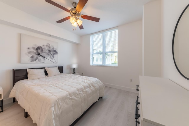 bedroom featuring ceiling fan and light hardwood / wood-style flooring