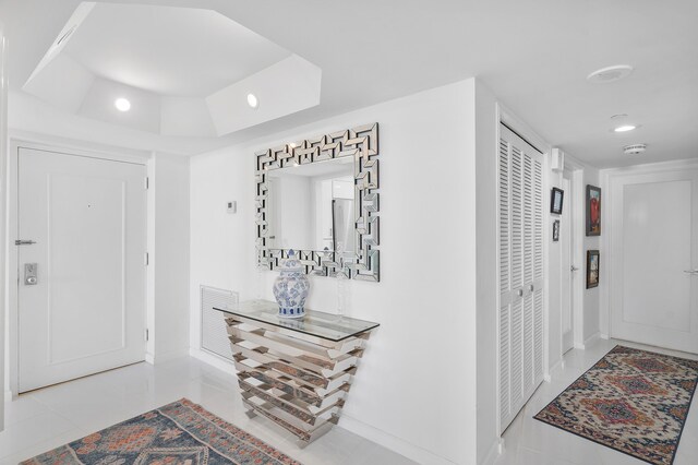 hallway with light tile patterned floors