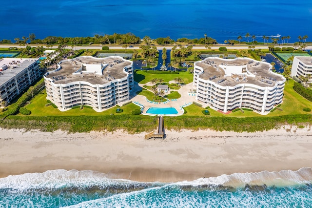 bird's eye view with a beach view and a water view