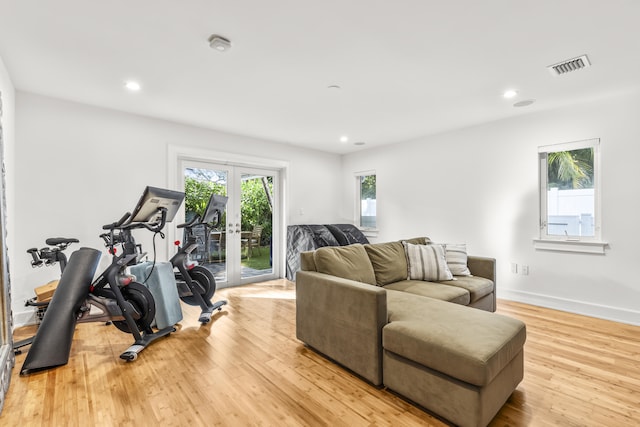 workout area featuring light wood-type flooring