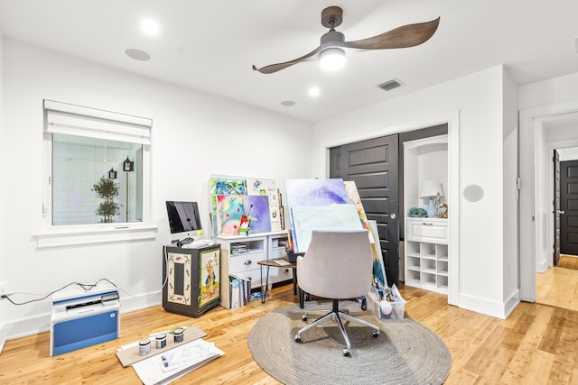 office space with hardwood / wood-style flooring and ceiling fan