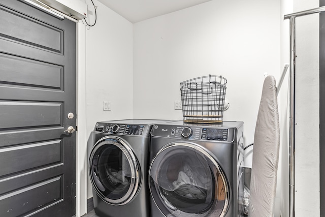 laundry area featuring washing machine and clothes dryer