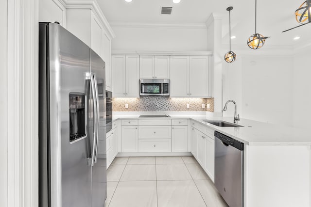 kitchen with sink, decorative light fixtures, white cabinetry, and appliances with stainless steel finishes