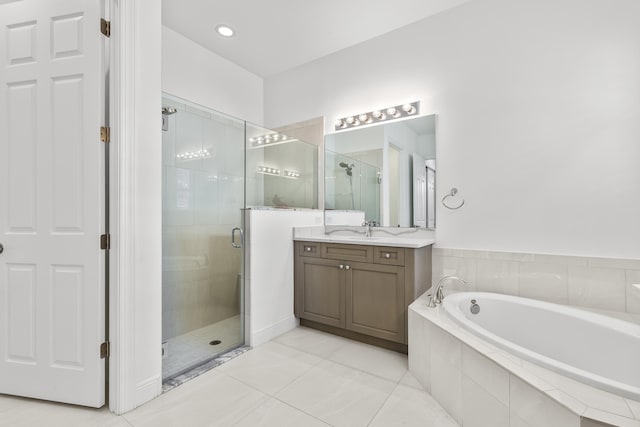 bathroom with vanity, tile patterned flooring, and independent shower and bath