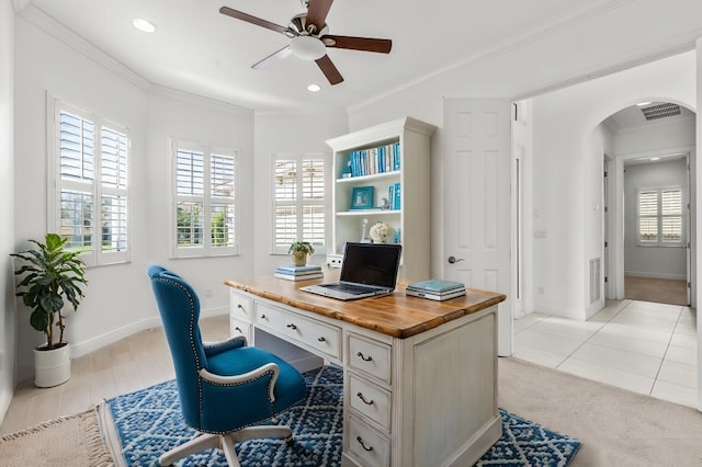 office featuring light tile patterned flooring, ceiling fan, and ornamental molding