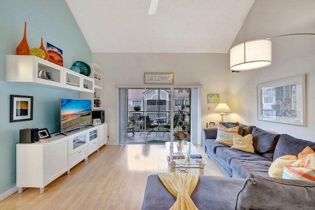 living room featuring light hardwood / wood-style flooring and lofted ceiling