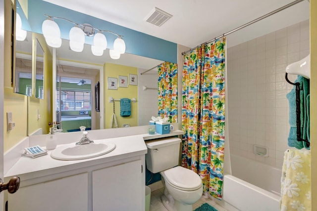 full bathroom with tile patterned flooring, shower / bath combination with curtain, toilet, and vanity