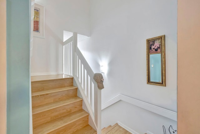 stairway featuring hardwood / wood-style floors