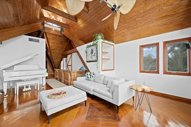 living area with visible vents, a ceiling fan, vaulted ceiling with skylight, wooden ceiling, and baseboards