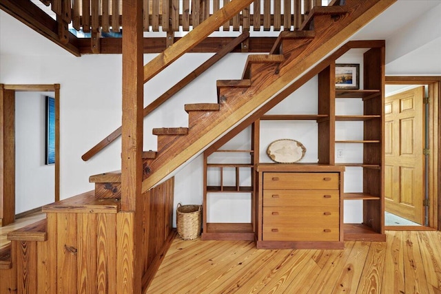 stairs featuring hardwood / wood-style flooring