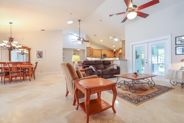 living room with ceiling fan with notable chandelier, high vaulted ceiling, and french doors