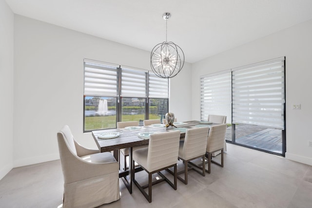 dining space featuring a notable chandelier